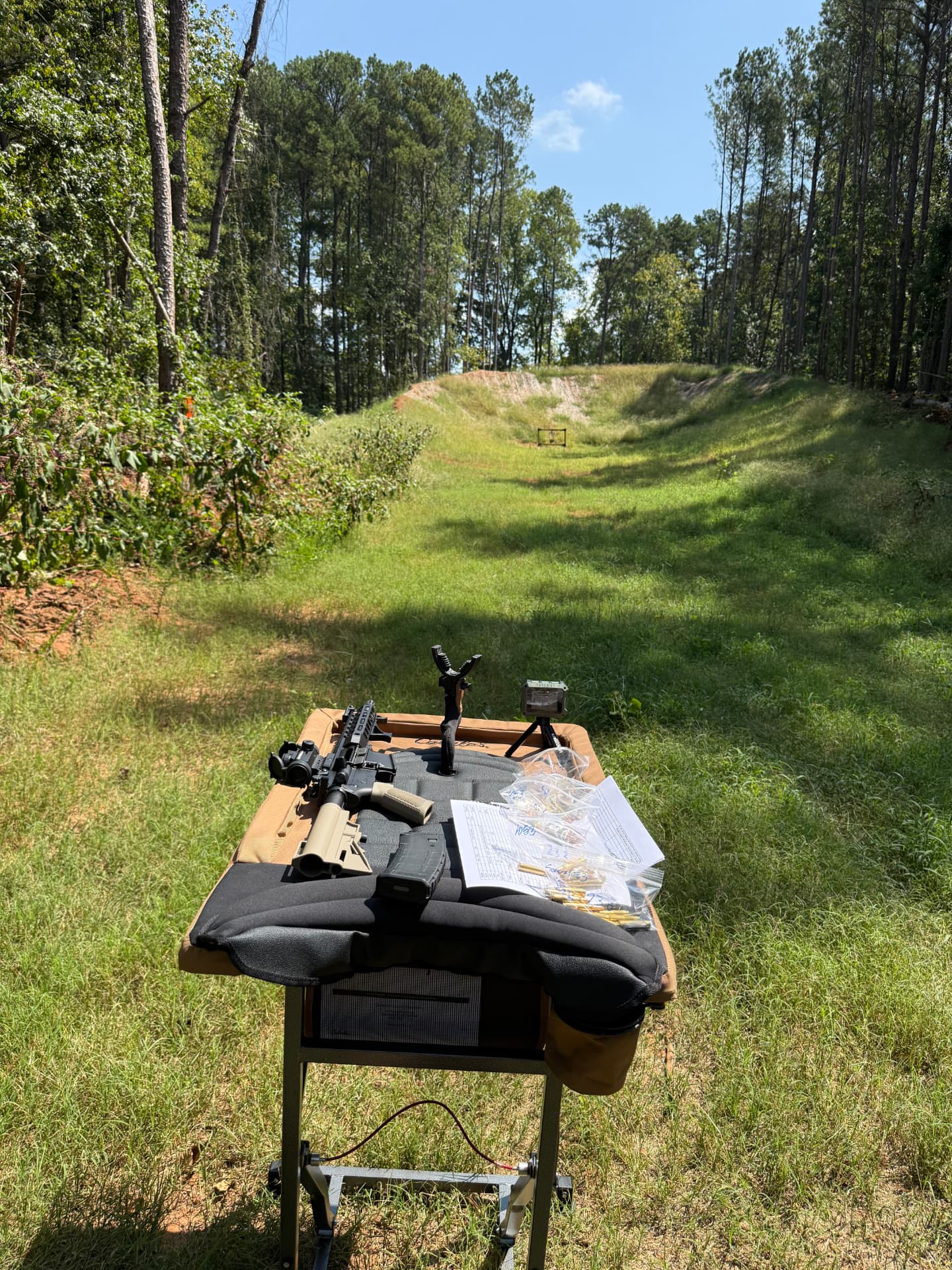 Shooting bench with a rifle and load data at the Fire Ammo testing range